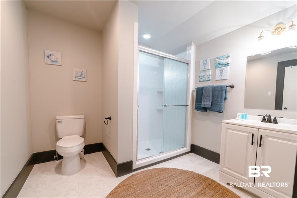 207 Michigan Avenue Mobile, AL 36604 - Photo 23 of 31 Full bathroom with vanity, a shower stall, and recessed lighting