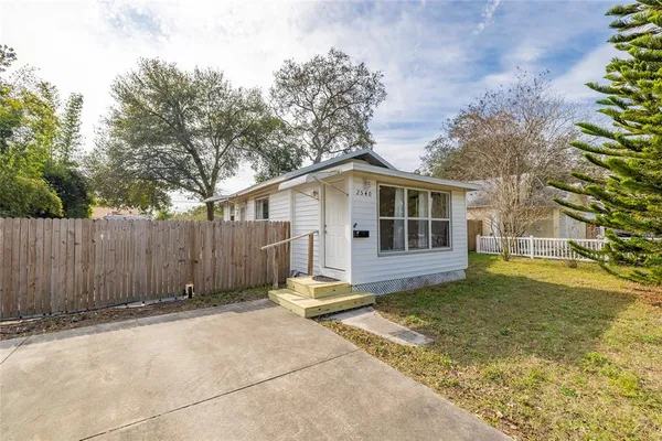 a house with trees in front of it