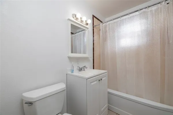 a bathroom with a sink a toilet and vanity