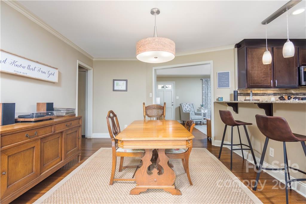 5201 Londonderry Road Charlotte, NC 28210 - Photo 12 of 42 a view of a dining room with furniture and wooden floor