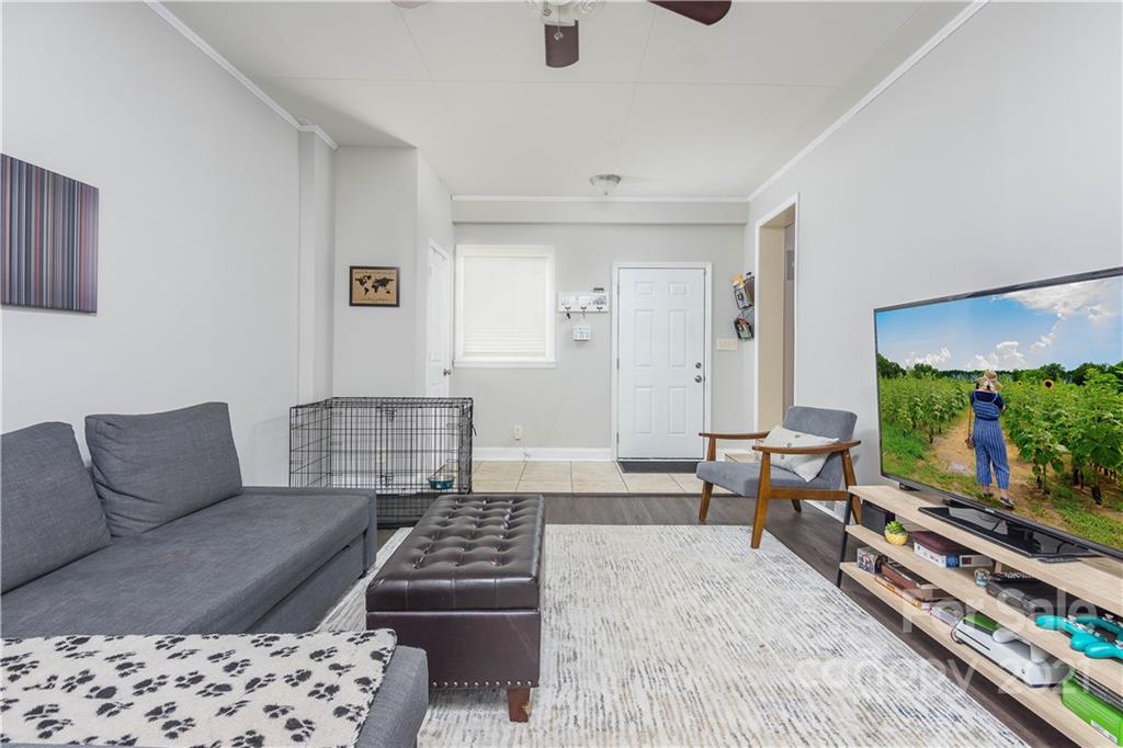 5201 Londonderry Road Charlotte, NC 28210 - Photo 20 of 42 a living room with furniture a rug and a flat screen tv