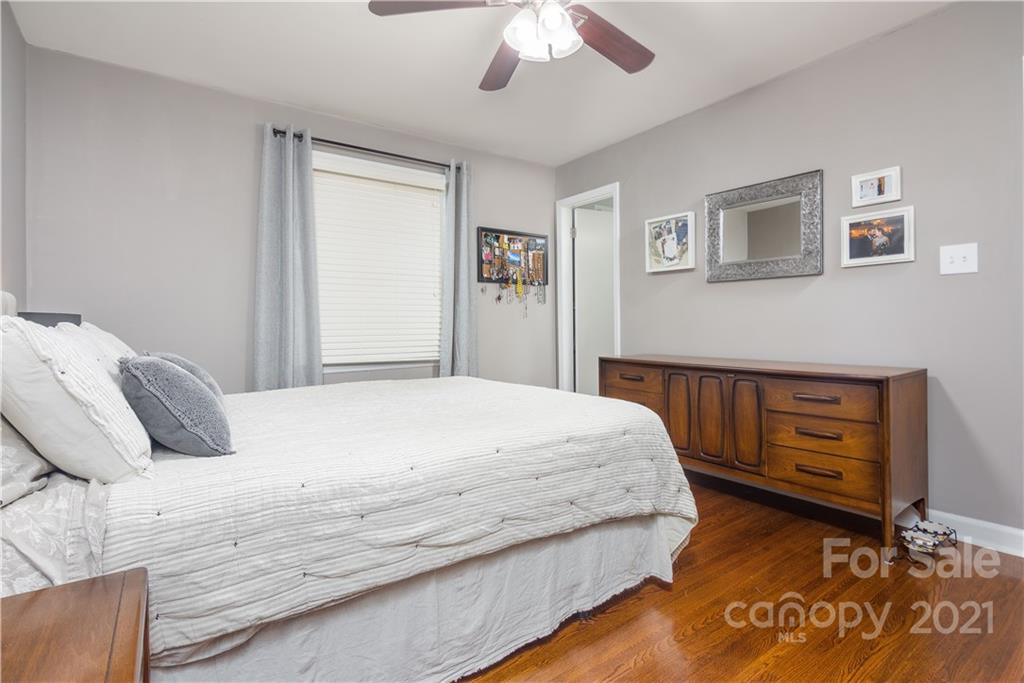 5201 Londonderry Road Charlotte, NC 28210 - Photo 27 of 42 a bedroom with a bed and a dresser