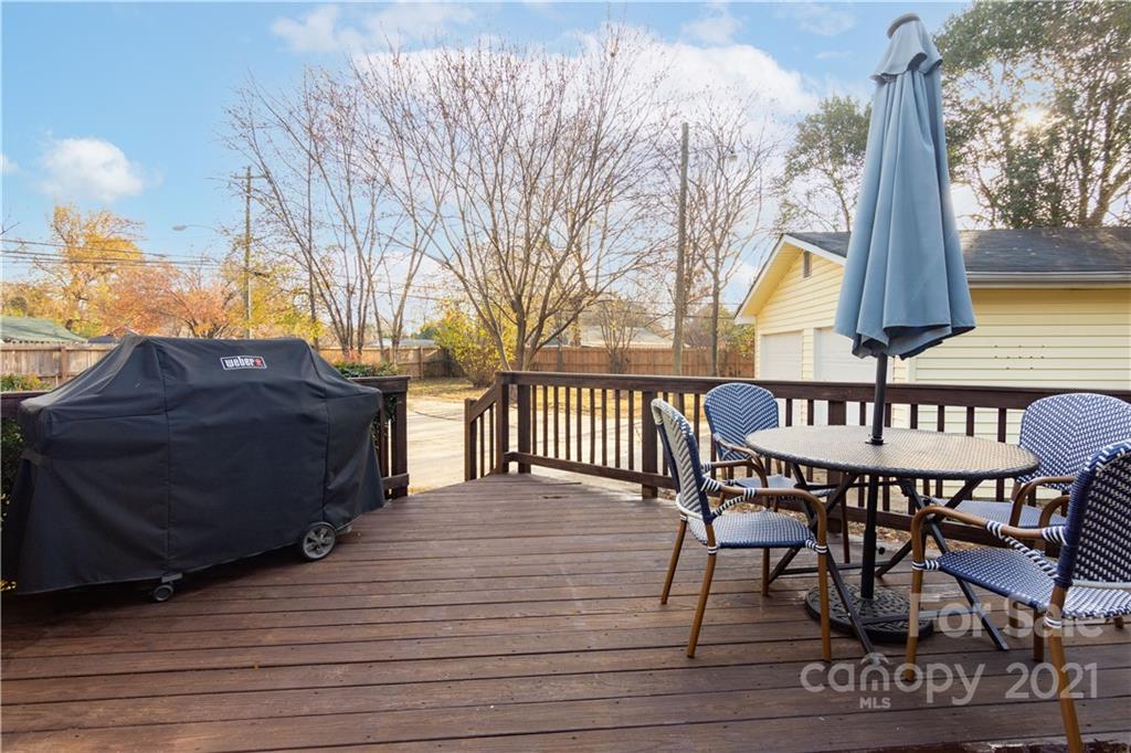 5201 Londonderry Road Charlotte, NC 28210 - Photo 4 of 42 a view of balcony with wooden floor and outdoor seating