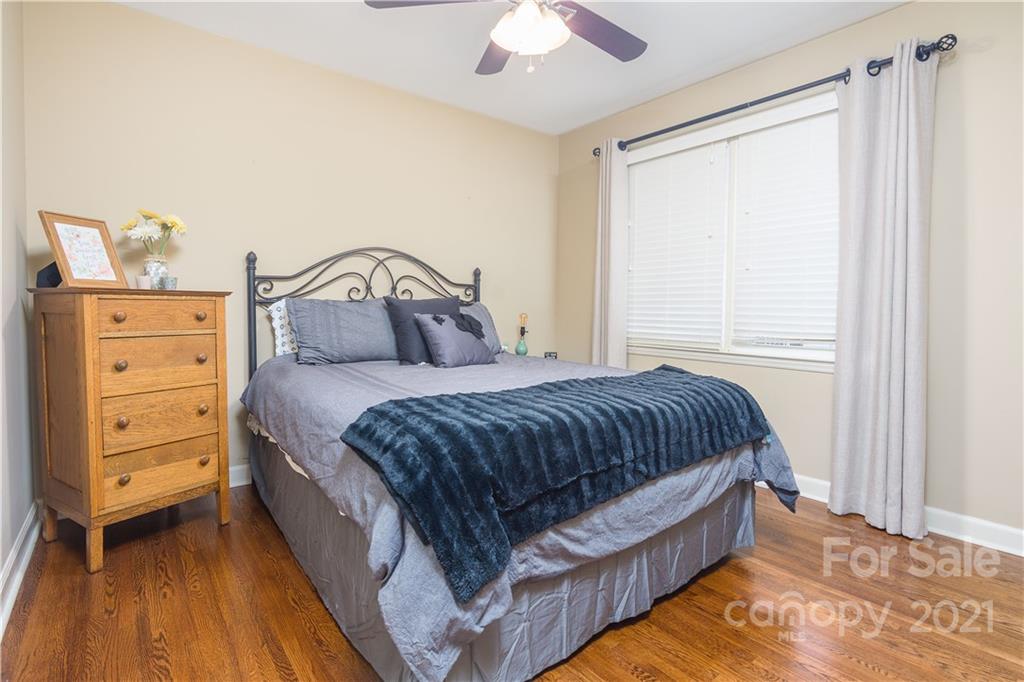 5201 Londonderry Road Charlotte, NC 28210 - Photo 33 of 42 a bedroom with a bed and a dresser