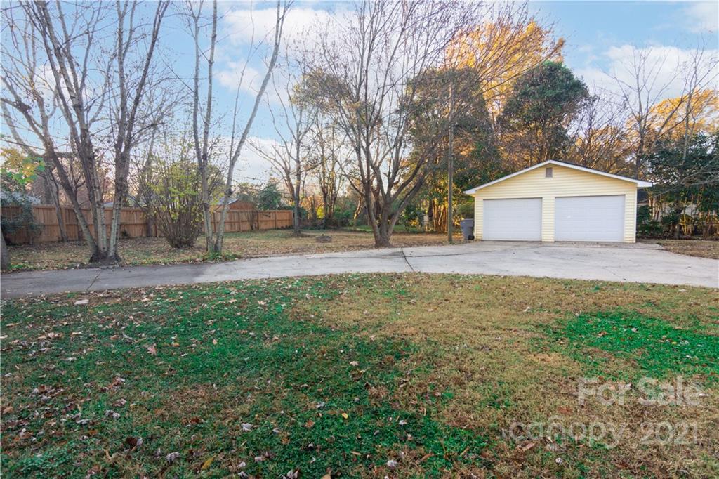 5201 Londonderry Road Charlotte, NC 28210 - Photo 39 of 42 a front view of a house with a yard and garage