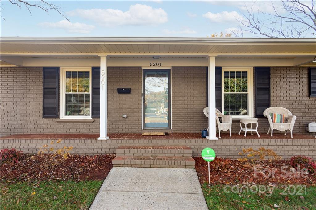5201 Londonderry Road Charlotte, NC 28210 - Photo 5 of 42 a front view of a house with outdoor seating
