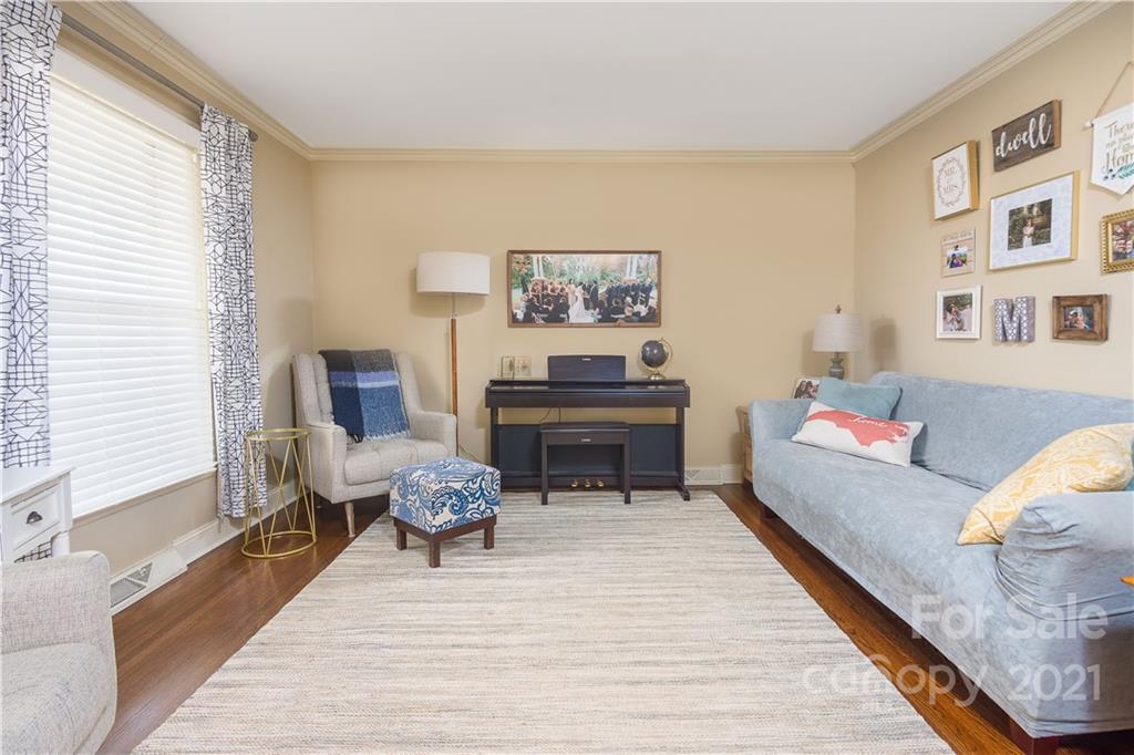 5201 Londonderry Road Charlotte, NC 28210 - Photo 6 of 42 a living room with furniture and paintings on the wall