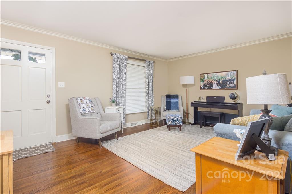 5201 Londonderry Road Charlotte, NC 28210 - Photo 8 of 42 a living room with furniture and a wooden floor
