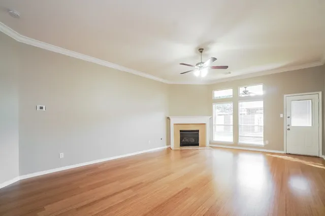 a view of a kitchen with wooden floor and a kitchen