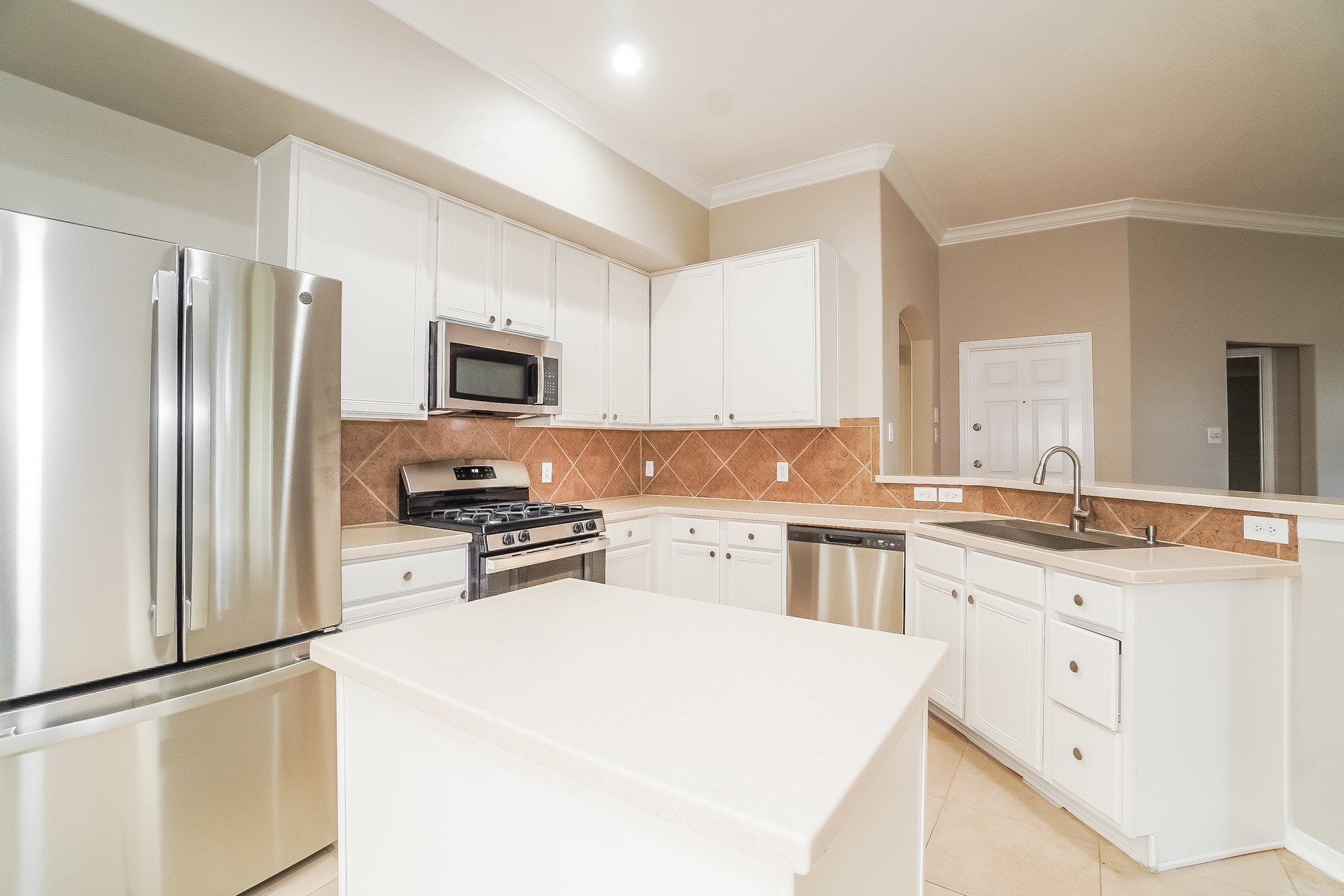 24223 Camillia Ridge Way Katy, TX 77493 - Photo 8 of 16 a kitchen with a refrigerator stove and sink