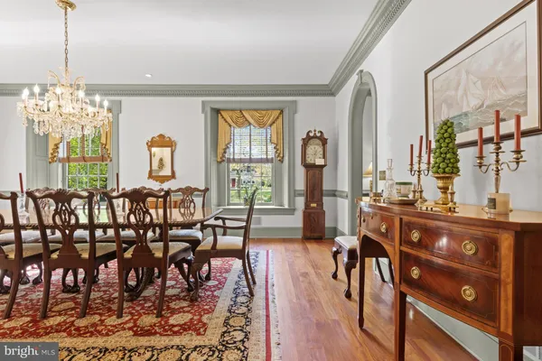 a view of a livingroom with furniture window and wooden floor