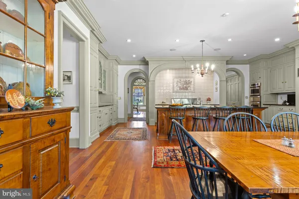a view of staircase with wooden floor and a window