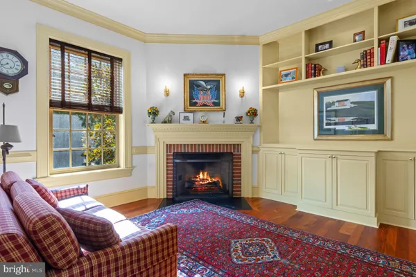 a spacious bedroom with a large bed a rug and a large window