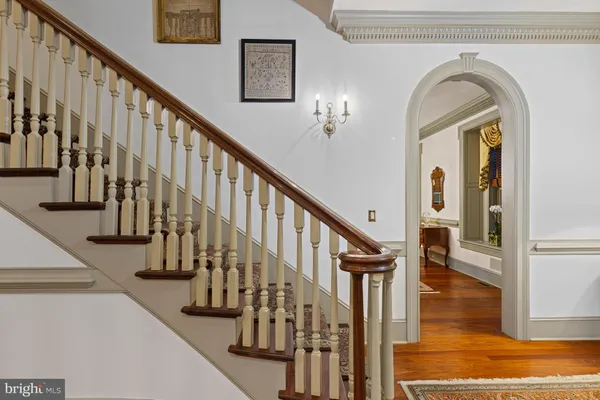 a living room with furniture rug and window