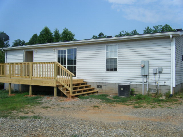 477 Mitchell Road Axton, VA 24054 - Photo 2 of 4 a view of a house with a backyard and stairs