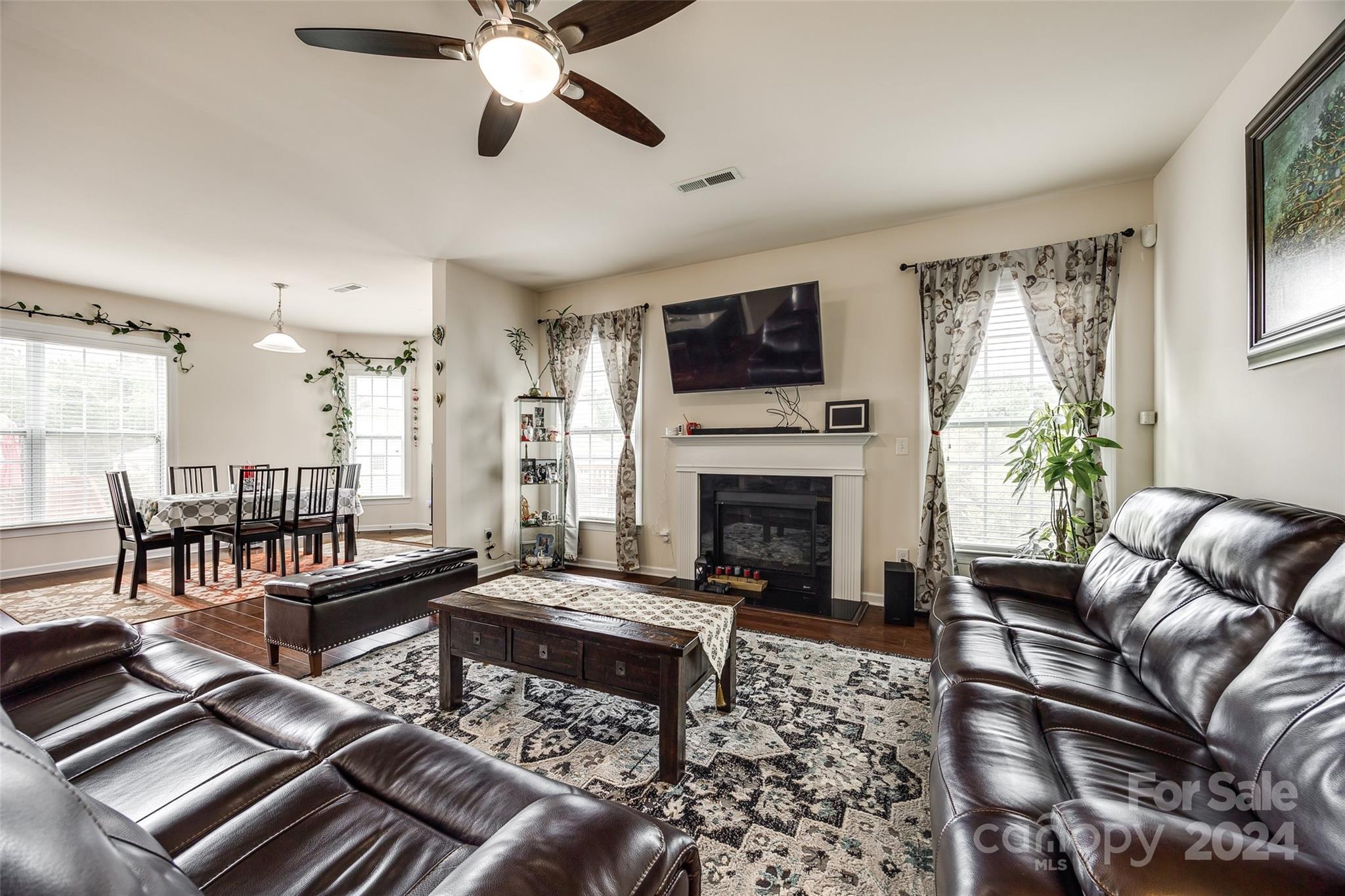 819 Bridge View Court Fort Mill, SC 29708 - Photo 13 of 40 a living room with furniture fireplace and a flat screen tv