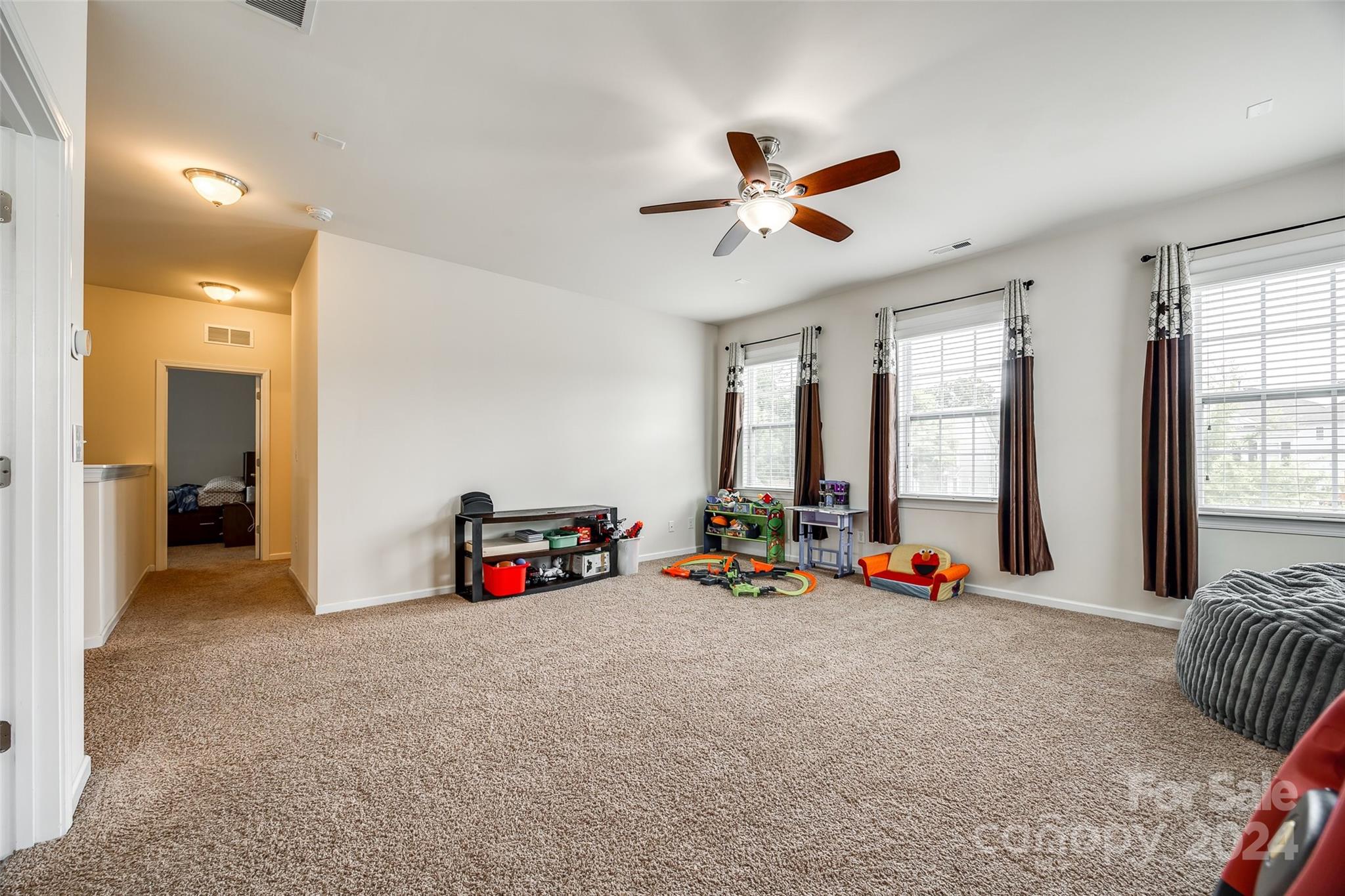 819 Bridge View Court Fort Mill, SC 29708 - Photo 24 of 40 a view of a room with gym equipment and a large window