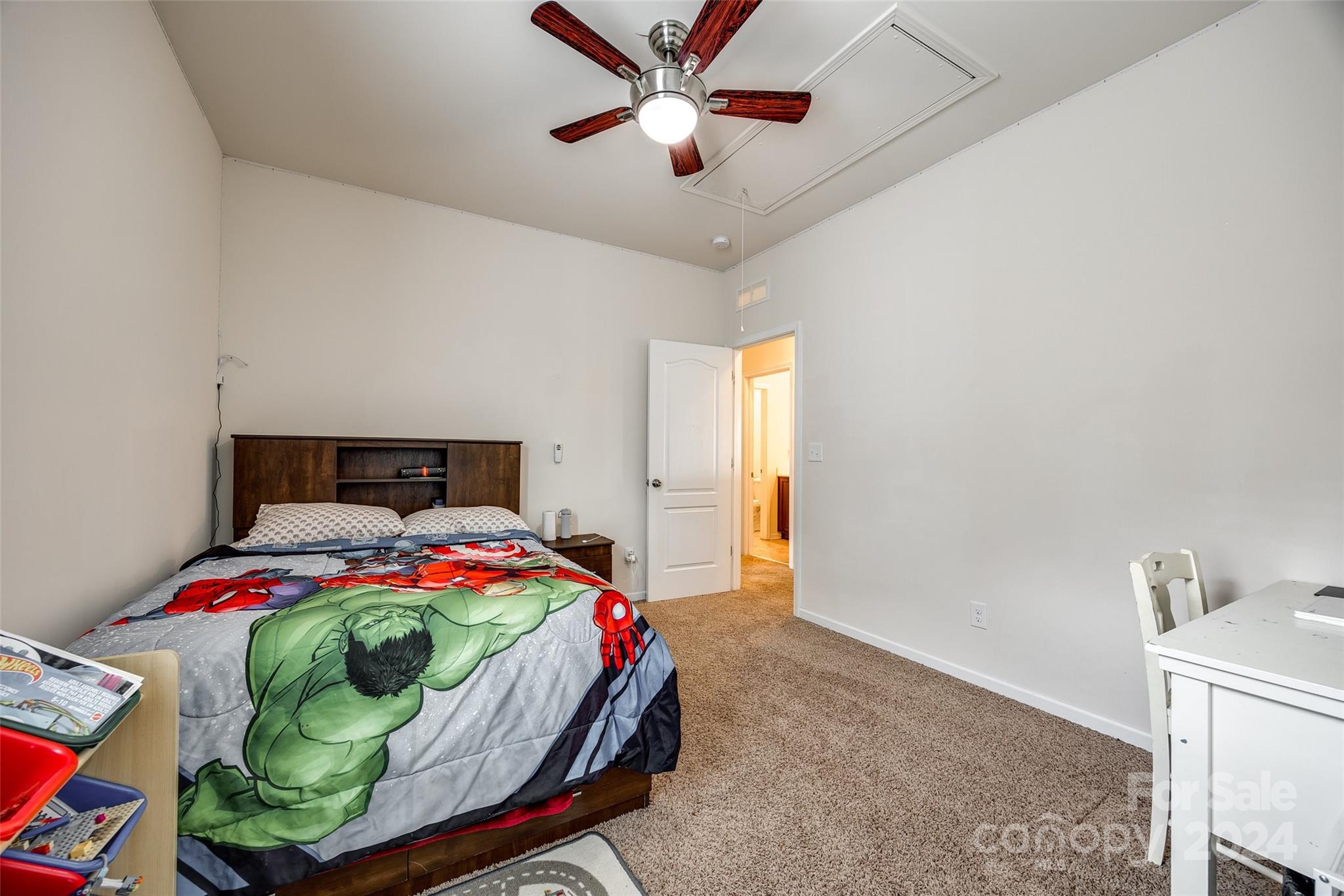 819 Bridge View Court Fort Mill, SC 29708 - Photo 27 of 40 a bedroom with a bed and a chandelier