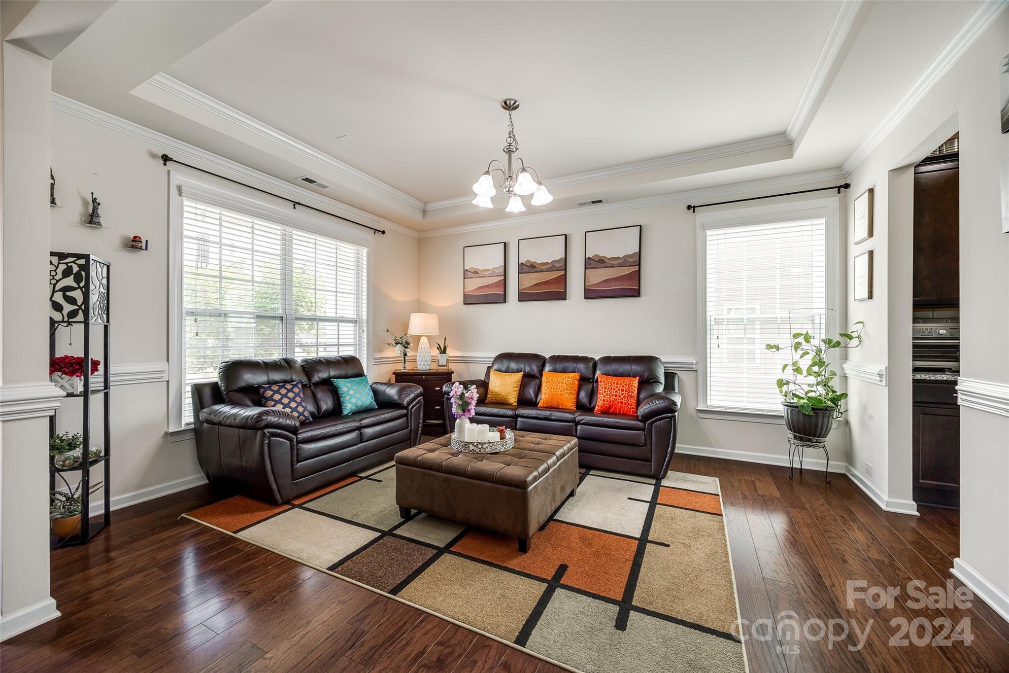819 Bridge View Court Fort Mill, SC 29708 - Photo 4 of 40 a living room with furniture and a flat screen tv