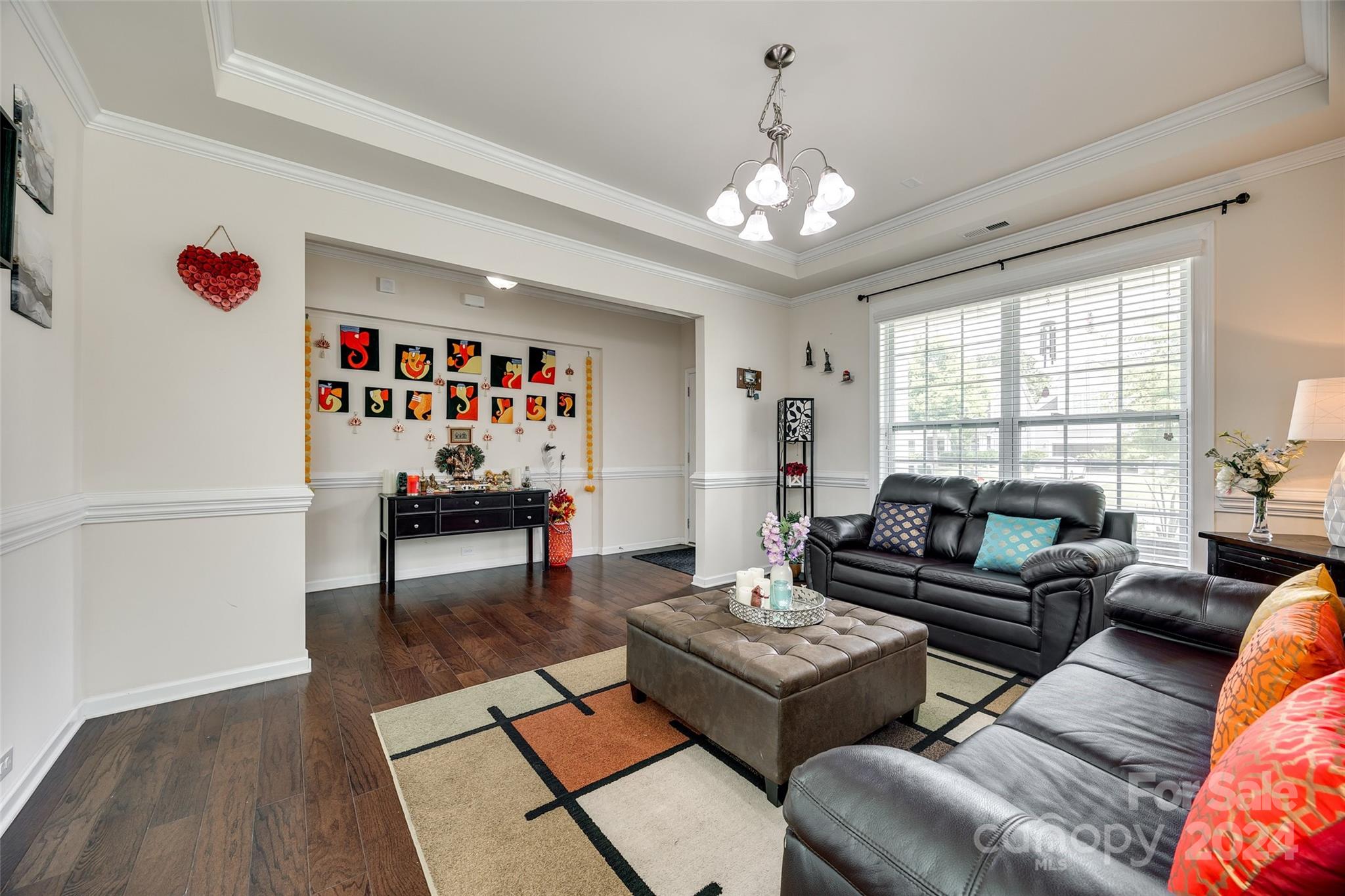 819 Bridge View Court Fort Mill, SC 29708 - Photo 5 of 40 a living room with furniture and a chandelier