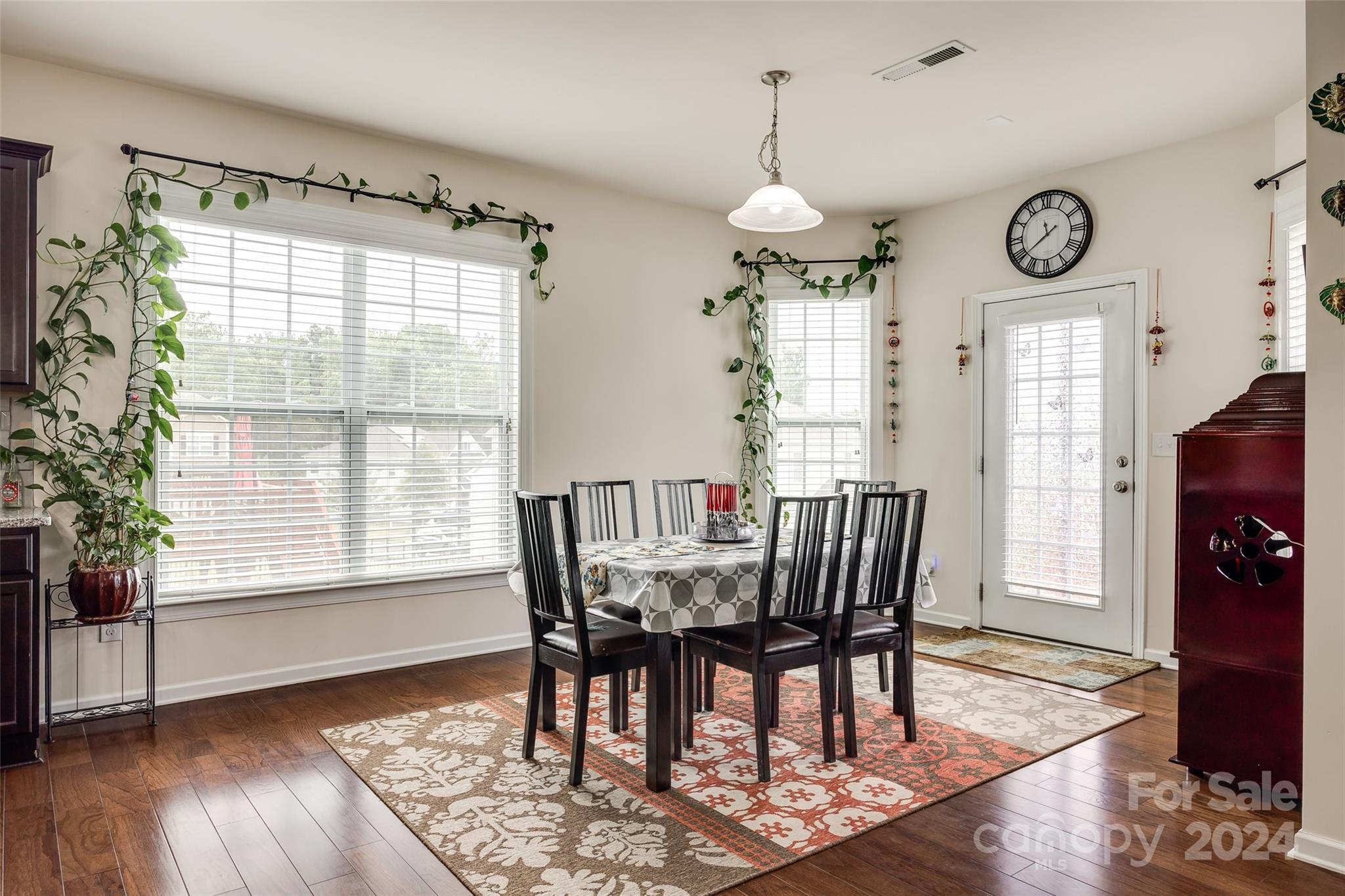 819 Bridge View Court Fort Mill, SC 29708 - Photo 9 of 40 a view of a dining room with furniture window and wooden floor