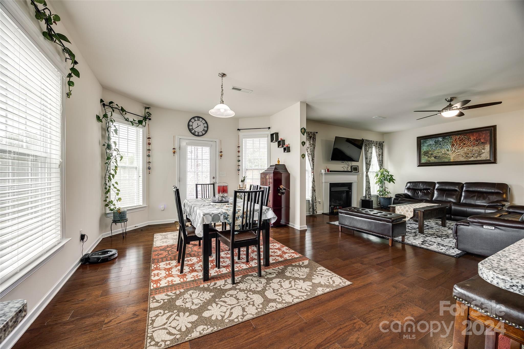 819 Bridge View Court Fort Mill, SC 29708 - Photo 10 of 40 a living room with fireplace furniture and a wooden floor