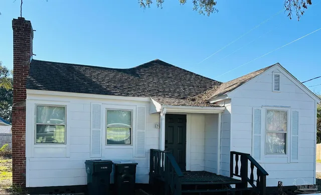 a front view of a house with glass windows