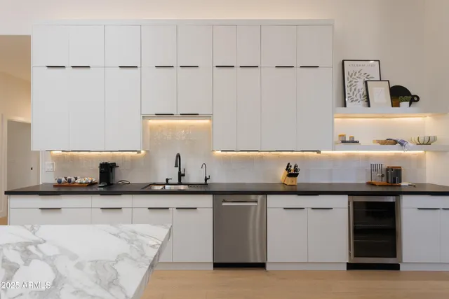 a kitchen with a sink and cabinets