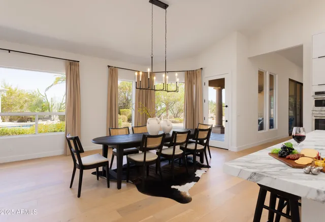 a view of a dining room with furniture window and outside view