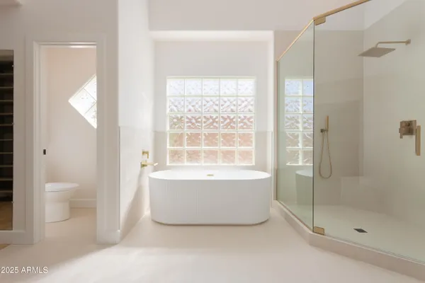 a bathroom with a bathtub and toilet