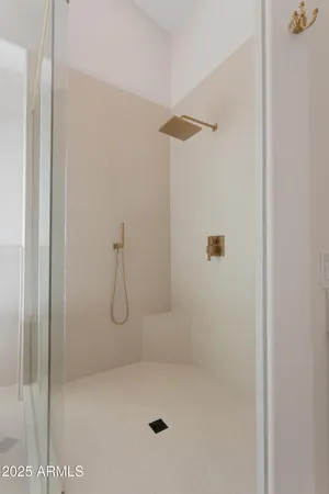 a bathroom with a glass shower door