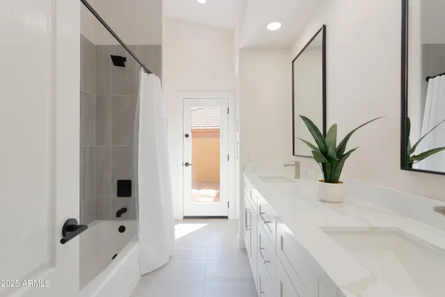 a bathroom with a bathtub and a sink