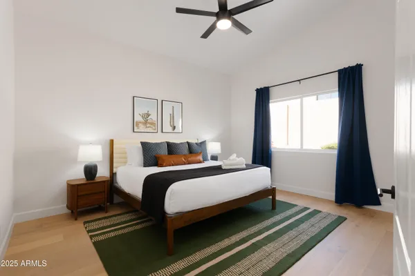 a bedroom with bed and window