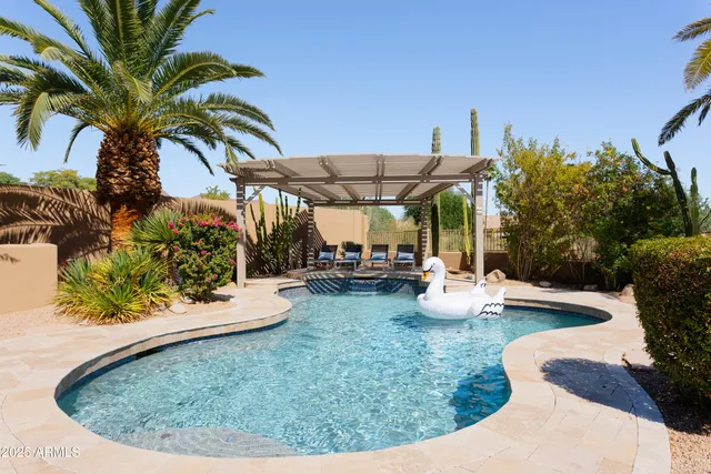 a view of a swimming pool with a patio