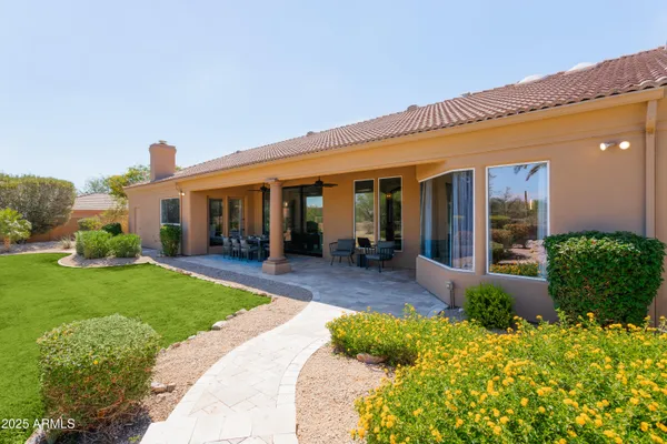 a view of a house with garden and plants