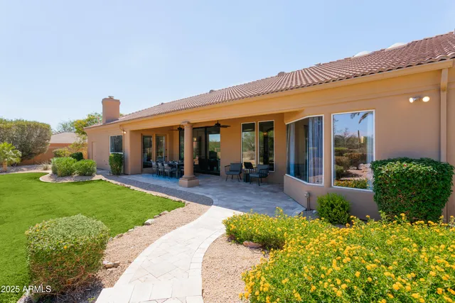 a view of a house with garden and plants