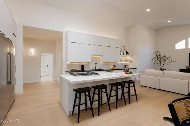 a kitchen with a table and chairs