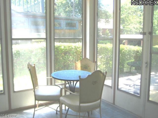 2648 Traymore Road Cleveland, OH 44118 - Photo 14 of 19 CHARMING SUN ROOM OFF LIVING ROOM WITH DOORS TO BACKYARD