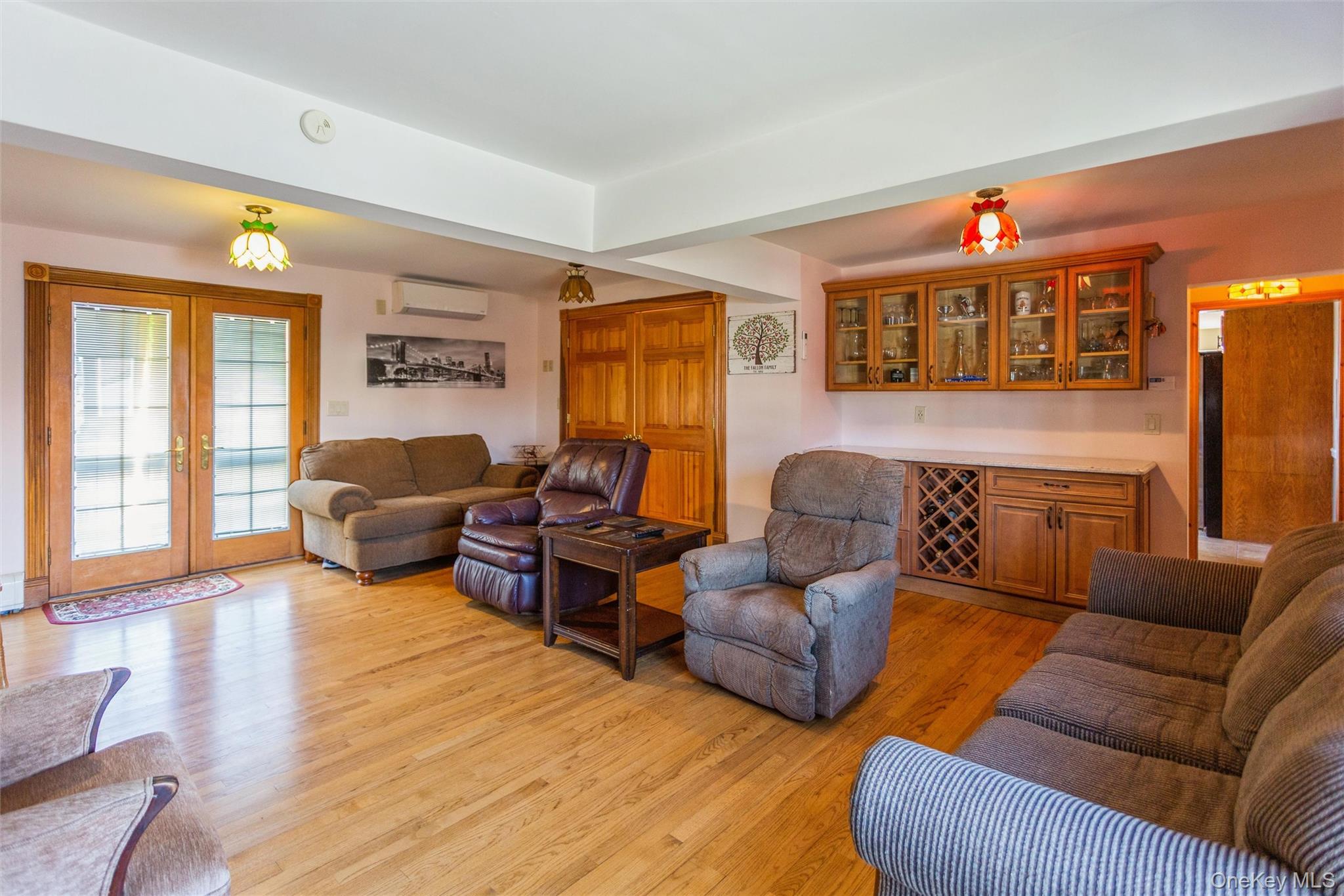 73 Parma Road Island Park, NY 11558 - Photo 13 of 37 a living room with furniture a couch and a window