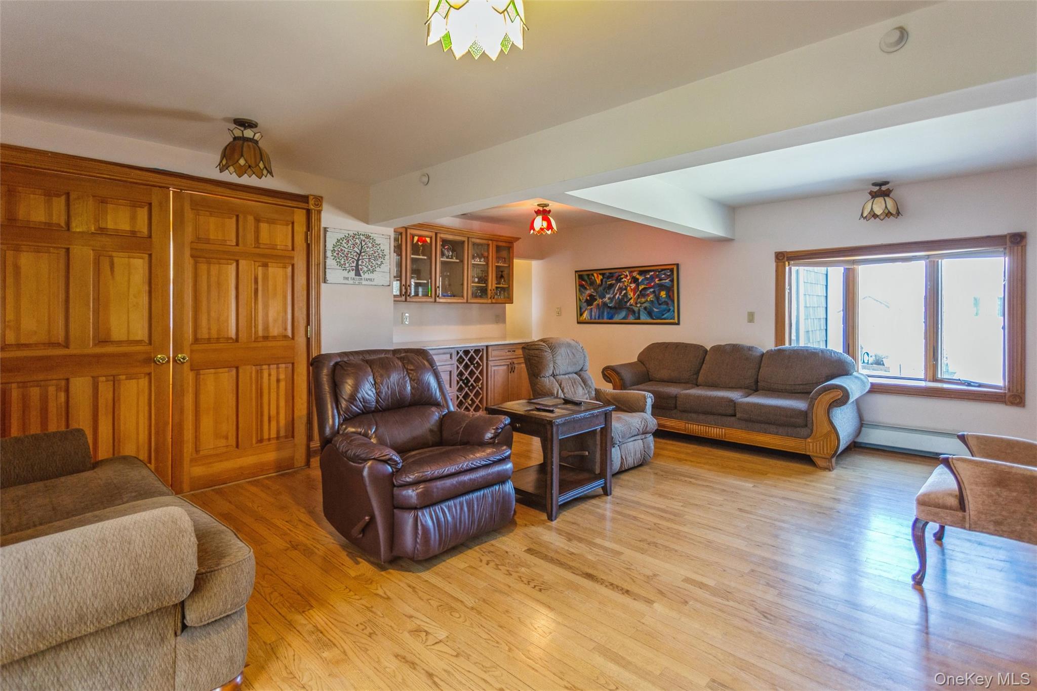 73 Parma Road Island Park, NY 11558 - Photo 14 of 37 a living room with furniture window and wooden floor