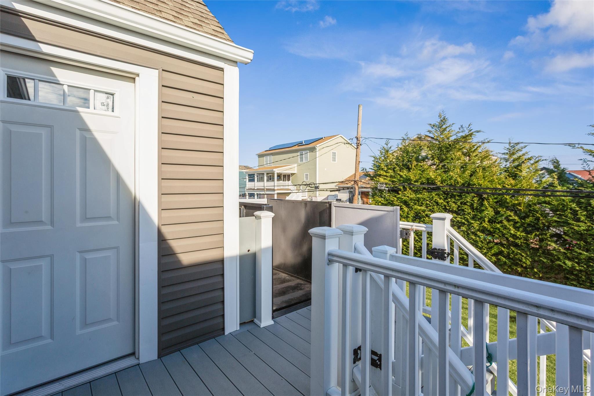 73 Parma Road Island Park, NY 11558 - Photo 16 of 37 a view of a balcony with an outdoor space