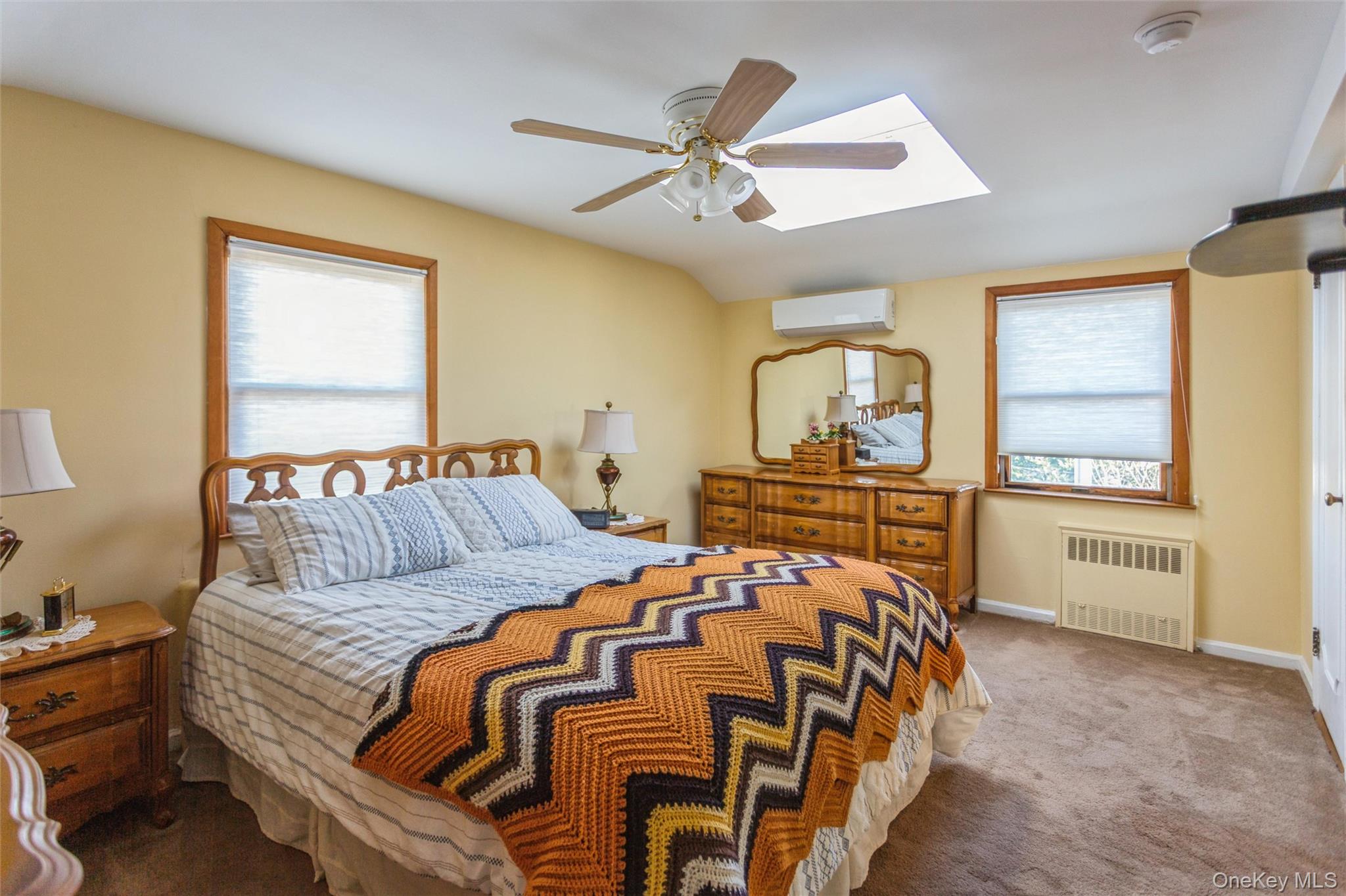 73 Parma Road Island Park, NY 11558 - Photo 20 of 37 a bed sitting in a bedroom next to a window