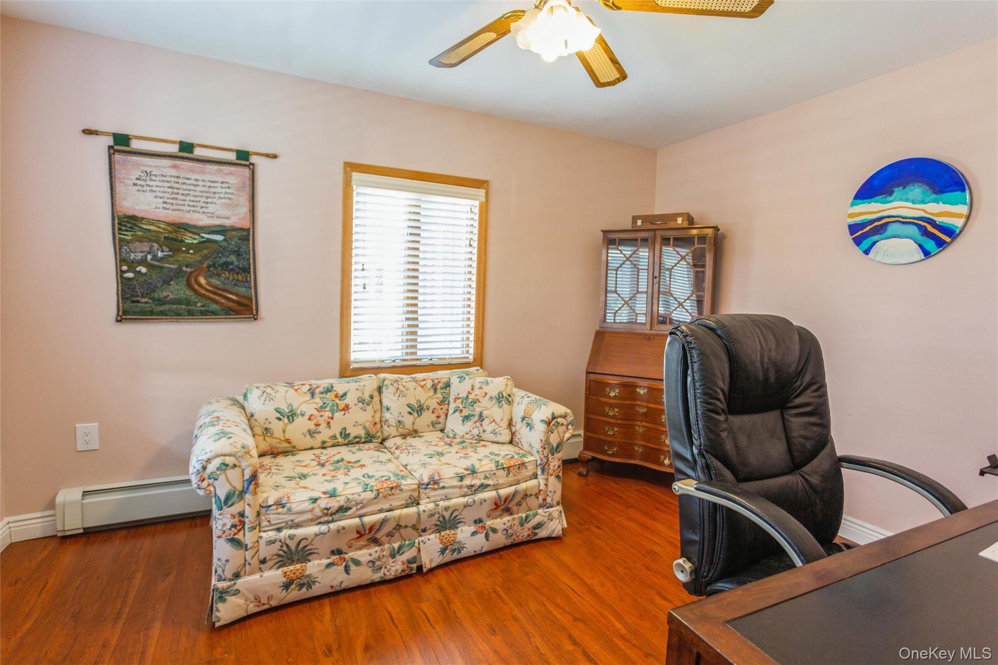 73 Parma Road Island Park, NY 11558 - Photo 2 of 37 a bedroom with a bed and window
