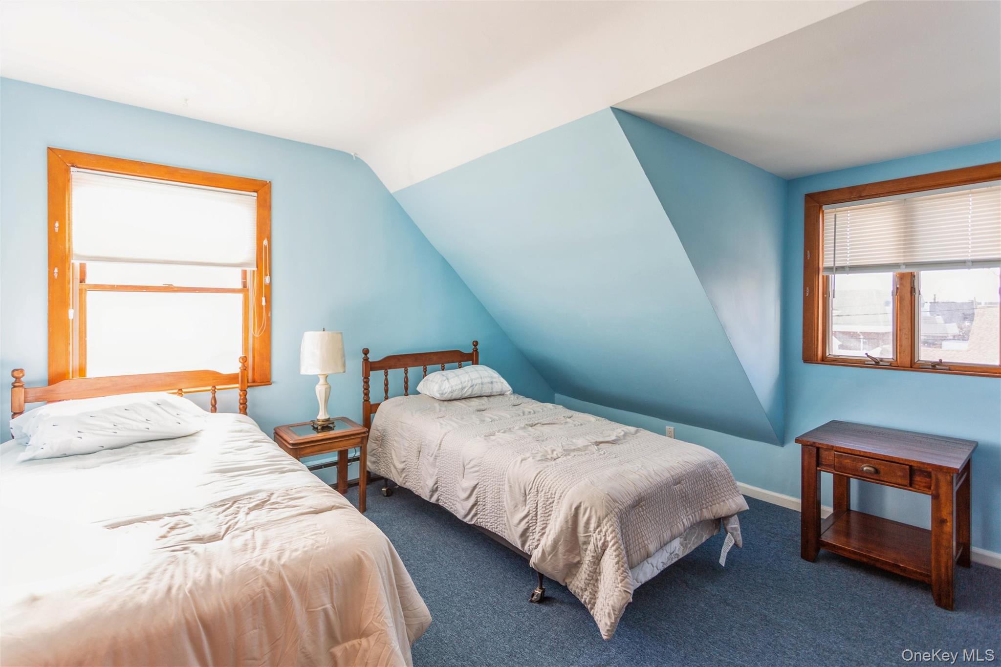 73 Parma Road Island Park, NY 11558 - Photo 23 of 37 a bedroom with two beds and a window