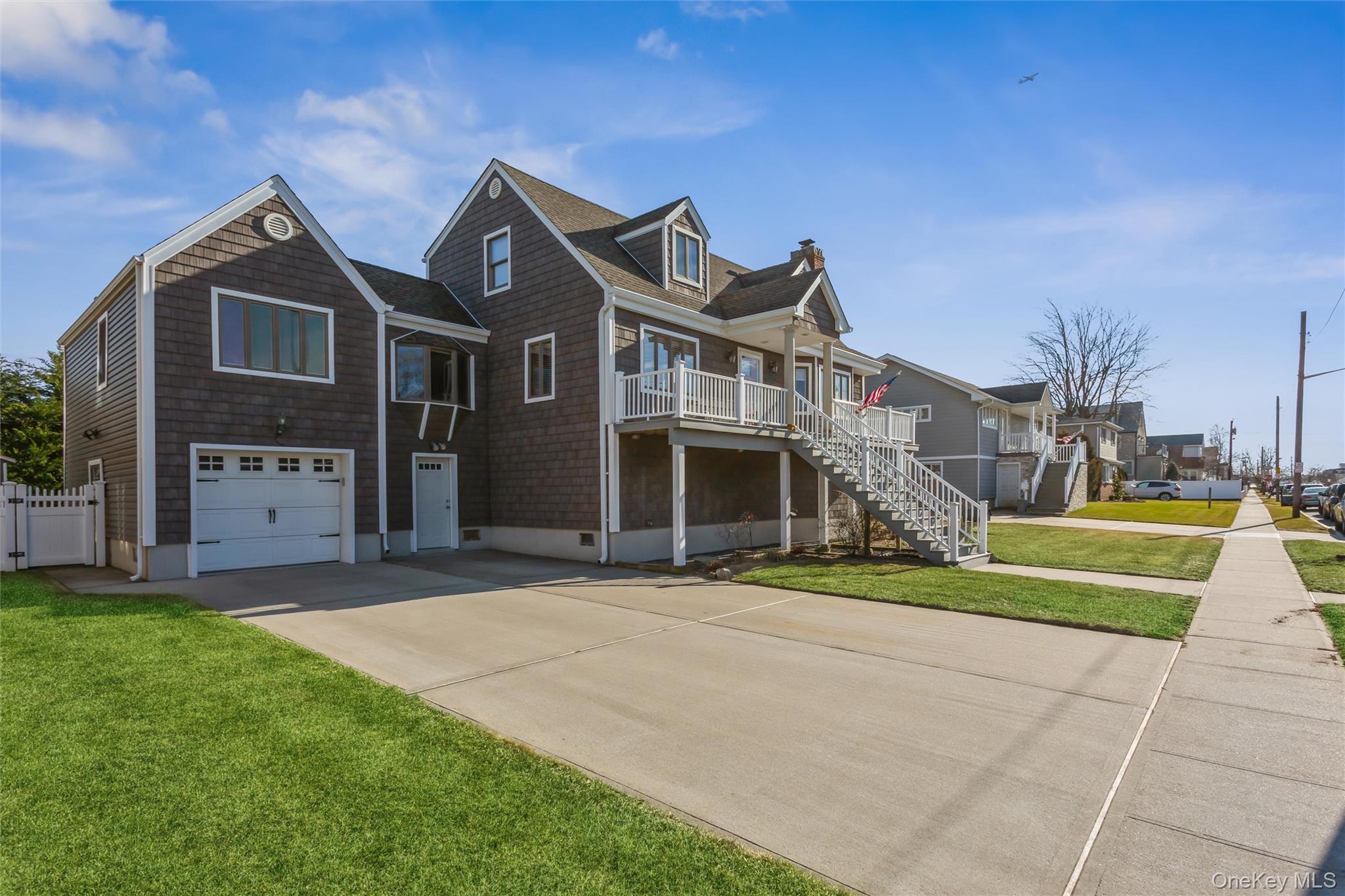 73 Parma Road Island Park, NY 11558 - Photo 27 of 37 a front view of a house with a yard