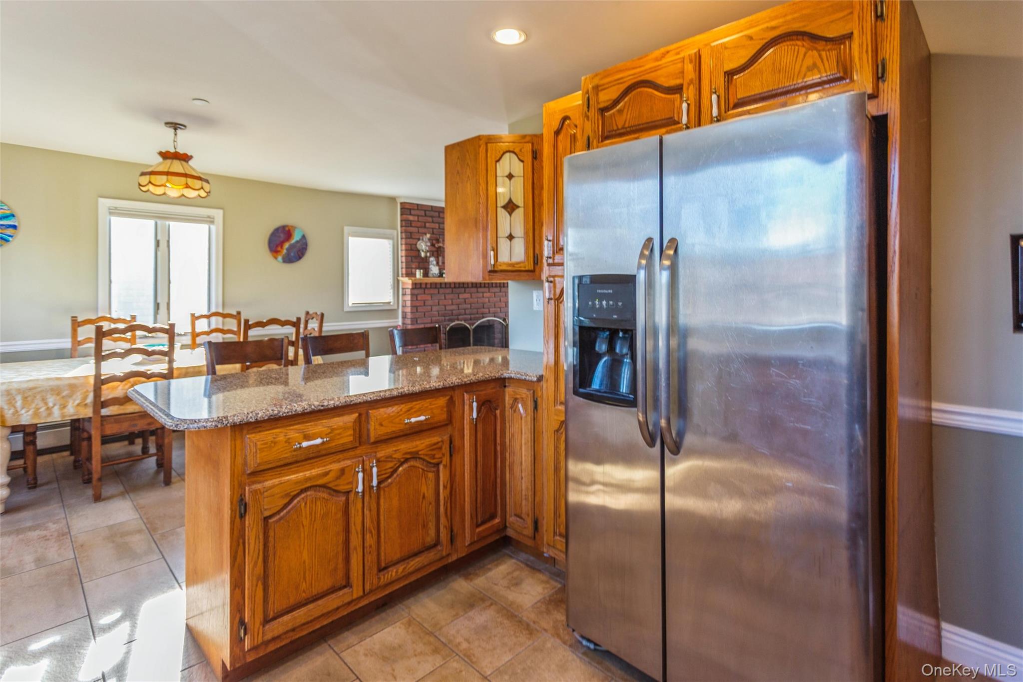 73 Parma Road Island Park, NY 11558 - Photo 10 of 37 a kitchen with stainless steel appliances granite countertop a refrigerator and a sink