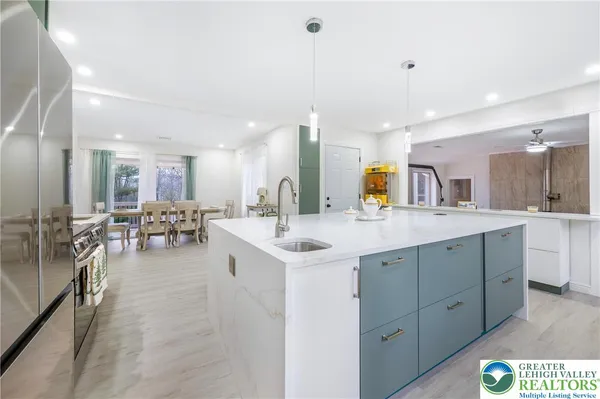 a kitchen with a sink and cabinets