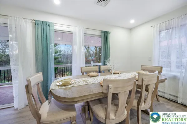 a view of a dining room with furniture window and outside view