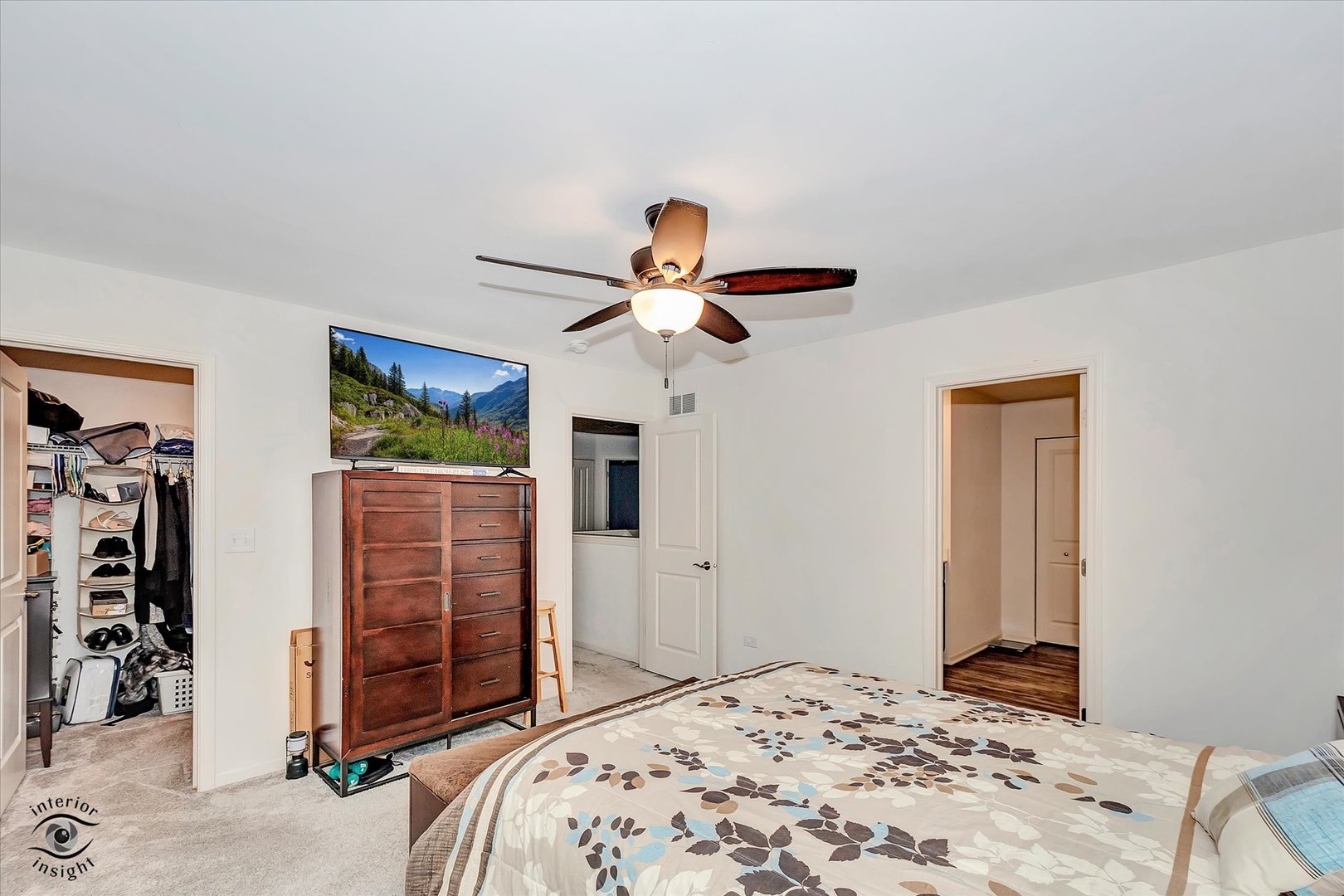 15101 Quincy Way Manhattan, IL 60442 - Photo 19 of 28 a bedroom with a bed and a chandelier