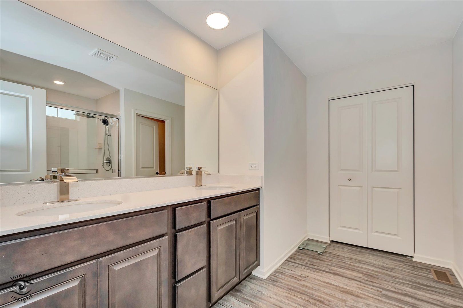 15101 Quincy Way Manhattan, IL 60442 - Photo 20 of 28 a bathroom with a double vanity sink and a mirror